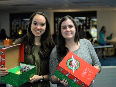 Katelyn Nichols (left) and Kylie Sutton display their Operation Christmas Child shoe boxes.