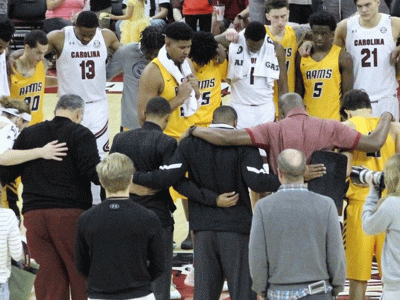 The CIU Rams lead in prayer following an exhibition game with the University of South Carolina Gamecocks.
