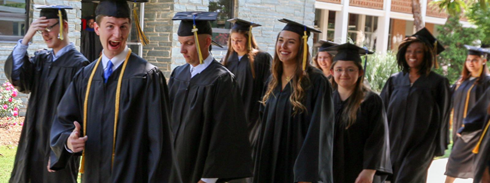 CIU Graduates head for the stage of Shortess Chapel at the May 2019 Commencement 