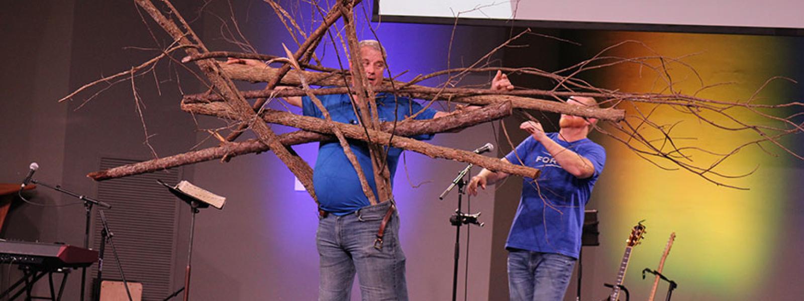 CIU alumnus Adrian Despres of Forge uses tree branches symbolizing sins to demonstrate how sin affects the Christian life. 