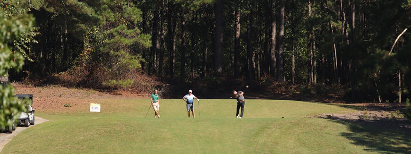 Golfers tee-off at the Columbia Country Club in the CIU Golf Classic