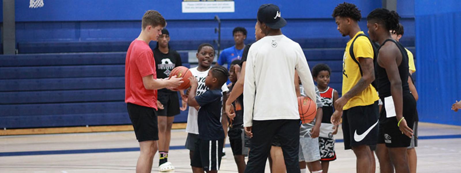 CIU Rams basketball players and local children at Hoop for Hope 
