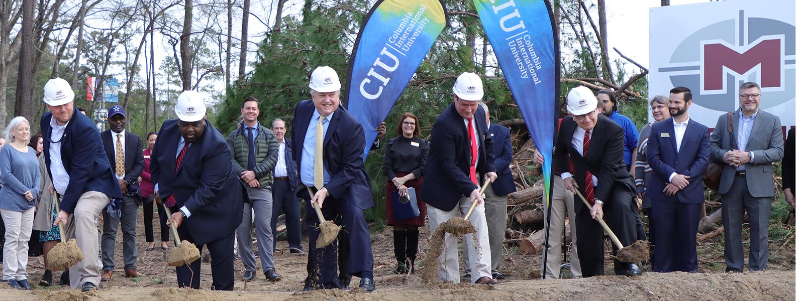 CIU administrators and a representative of Mashburn Construction turn the dirt in the groundbreaking ceremony. (Photos by Kierston Smith) 