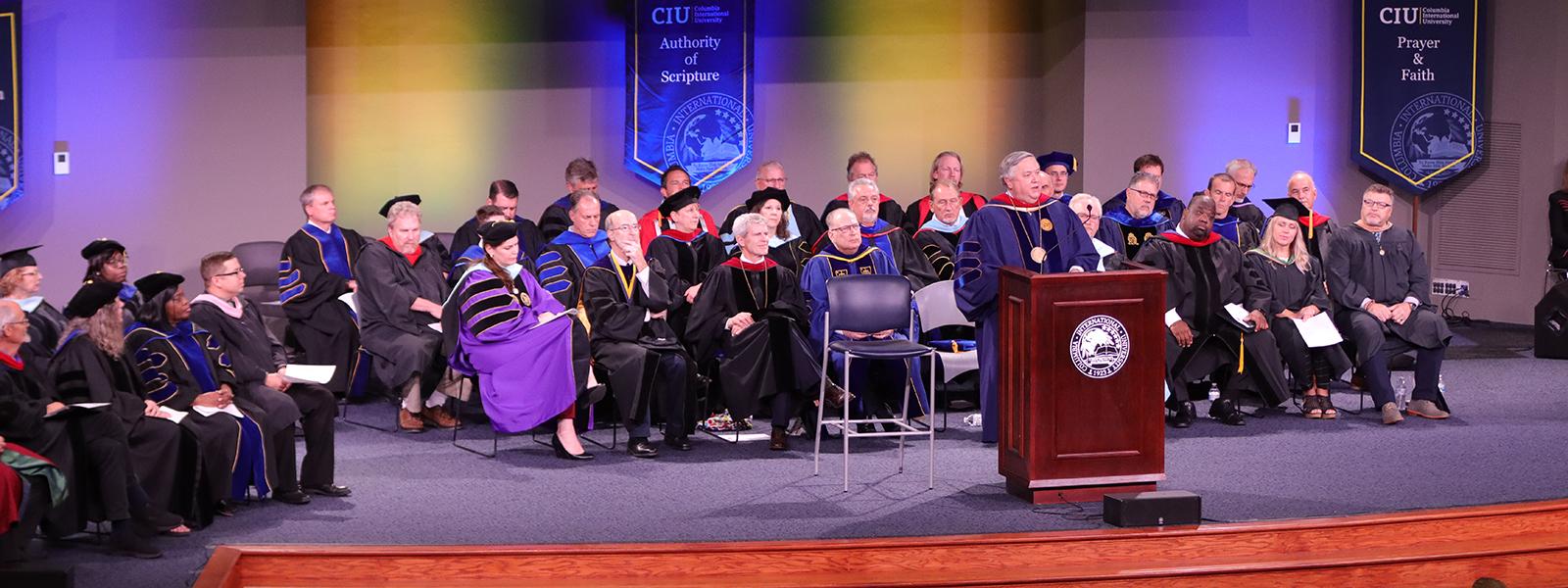 CIU President Dr. Mark A. Smith is flanked by the faculty at the '22-'23 convocation. 