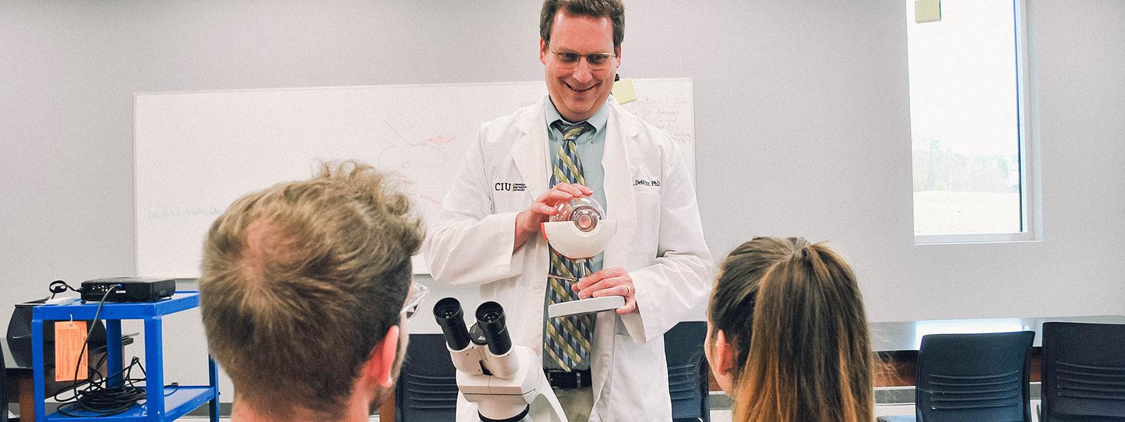 Professor Dr. David Dewitt teaches in the CIU Biology lab. 
