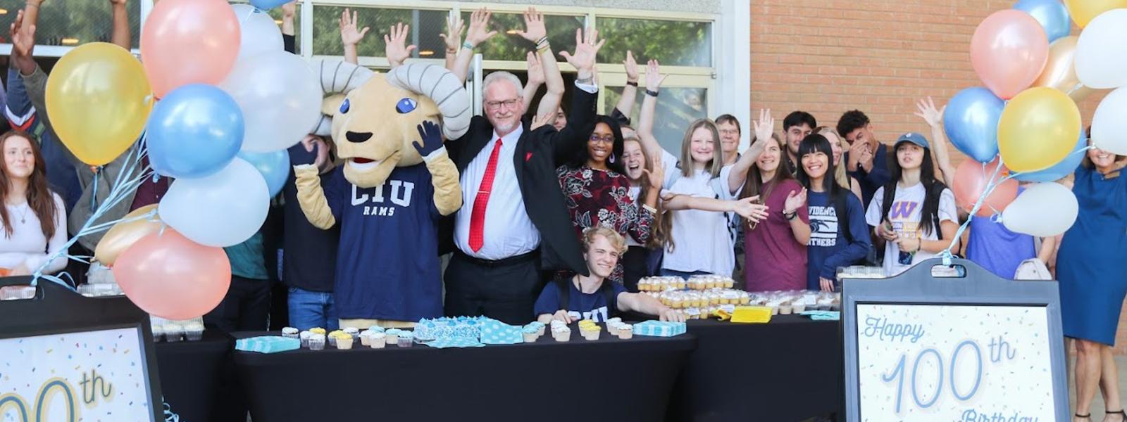 Interim President Dr. Rick Christman and CIU mascot Rammy join with students to celebrate. (Photo by Chariti Mealing, CIU Student Photographer) 