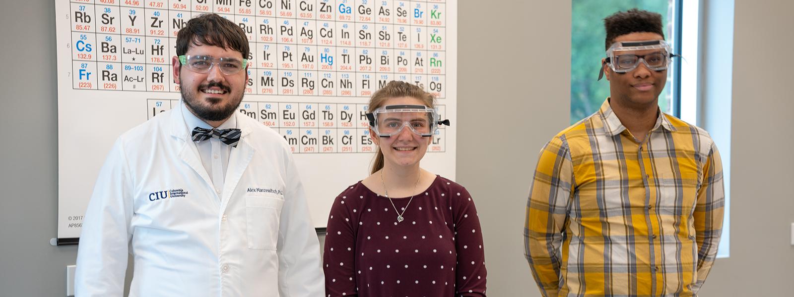 Assistant Chemistry Professor Dr. Alex Manzewitsch with students Taylor Hollis and Joshua Neath (Photo by Noah Allard)