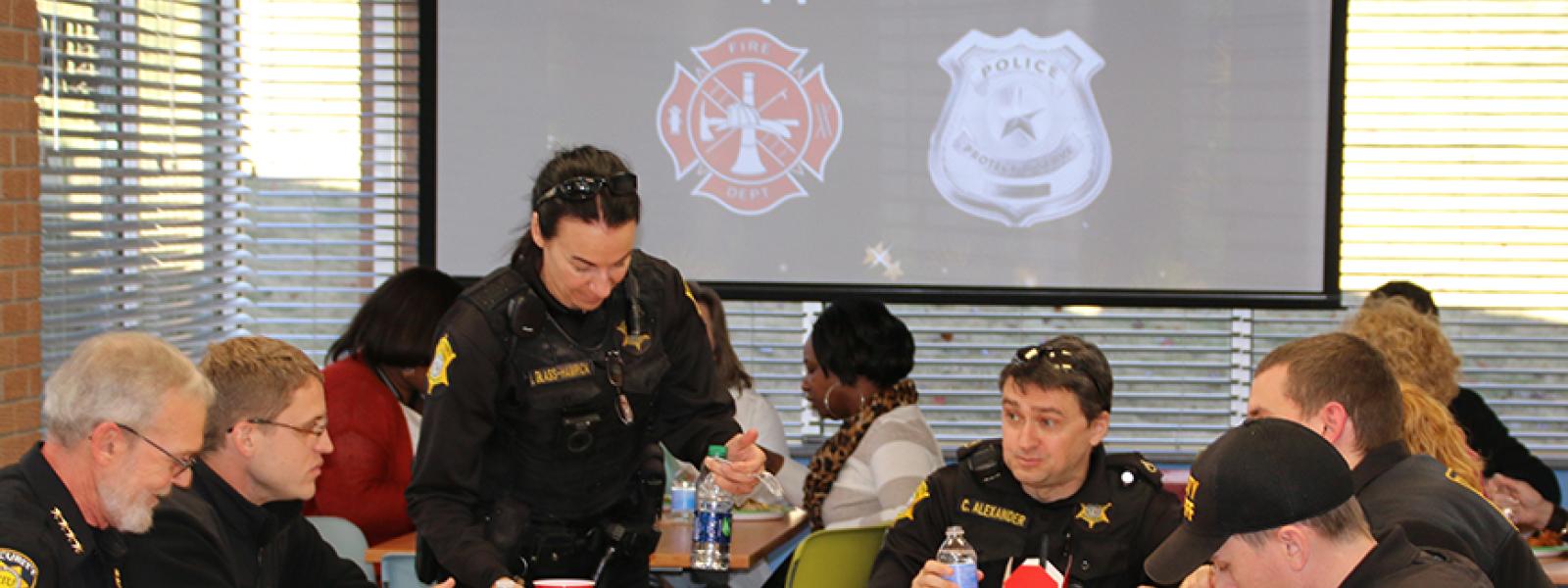 Business students show holiday appreciation for law enforcement and fire fighters