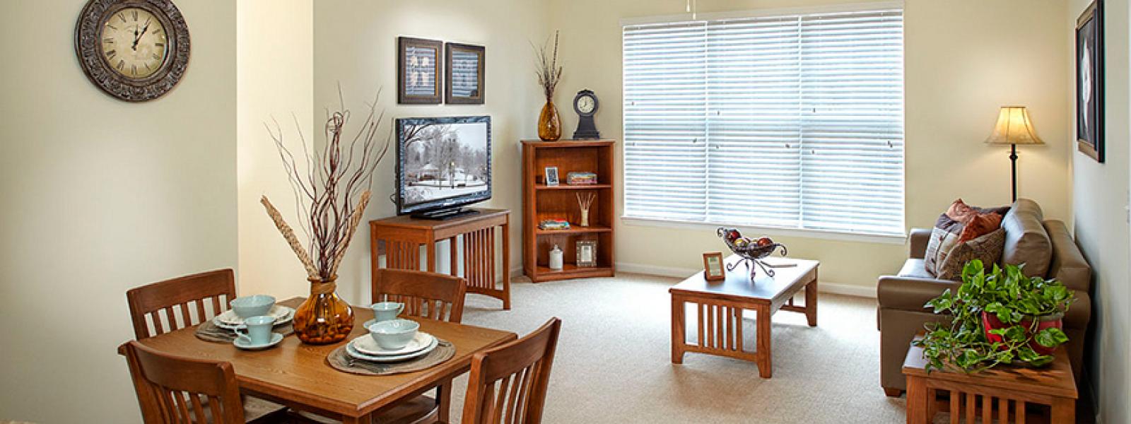 A photo of the living room and dining room at Pine View apartments on the campus of CIU.