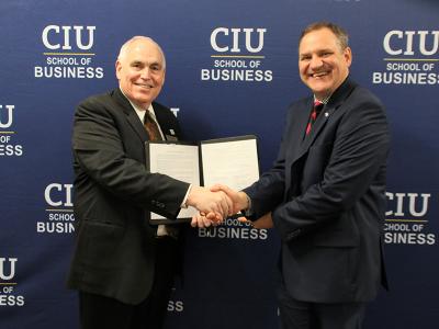 Dr. Scott Adams, dean of the CIU School of Business & Professional Studies (left) and Chad Hardaway of USCCTI after signing the MOU between the schools. (Photos by Kierston Smith)