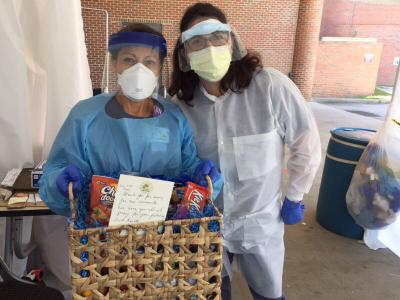 Health care workers display their CIU food basket outside Providence Health (Source: Twitter)