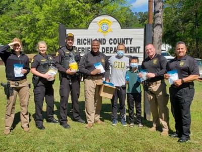 CIU Seminary student Tiepeng  Lyu and his son Thomas deliver masks to the Richland County Sheriff's Department (Photo provided