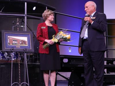 Lyn Cook is honored in Chapel by CIU Board of Trustees Chairman Hans Finzel 