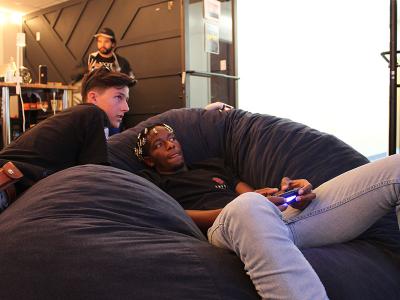 Zac Beckom (left), a freshman, and sophomore Isaac Winkfield enjoy beanbag chairs during intense gaming at Owen's Place. (Photos by Josh Ford, student photographer)