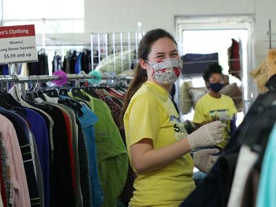 Kaitlyn Thompson sorts clothes at the Salvation Army thrift shop. (Photos by Kierston Smith)