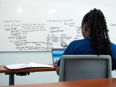 A CIU Business & Leadership Academy student reviews her business plan. (Photos by Ally Thumpston)