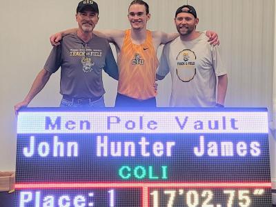 John Hunter James is flanked by Pole Vault Coach Rusty Shealy (left) and Head Coach Jud Brooker.