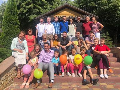 Pastor Andrew Moroz and his wife Samantha (bottom left) at a family reunion in Ukraine. (Photo courtesy of Andrew Moroz)
