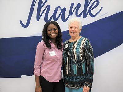 Clinical Counseling student Tryphene Dewanou of Benin in West Africa, poses with scholarship donor Anita Dubois.
