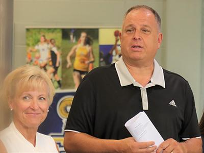CIU Athletics Director Darren Ritchie addresses the women's soccer team as Assistant Director Kim Abbott looks on. 