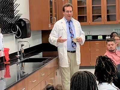 Dr. David DeWitt emphasizes safety at the first class in the science lab.