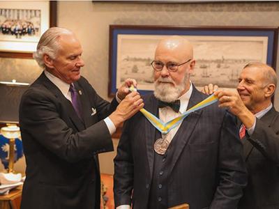 Dr. Tom Mullikin presented with the Order of Saint Maurice by South Carolina Gov. Henry McMaster (left). (Photo courtesy Thomas Smith)