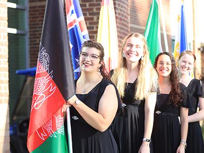 Members of the Ambassador Choir helped to carry the international flags.