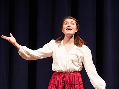 Savannah Easterling sings in the musical rendition of "Little Women" (Photo by Macey Drye, CIU Student Photographer)