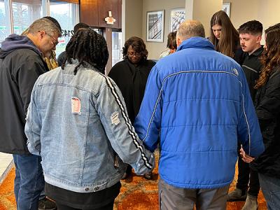 CIU students, faculty and staff form a circle of prayer in Wilmore, Kentucky. 