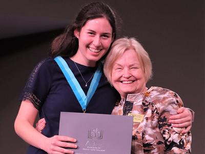 Kaitlyn Thompson received her Delta Epsilon Chi Honor Society recognition from the dean of the College of Education Dr. Connie Mitchell. (Photo by Kierston Smith)
