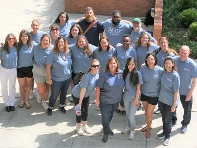 A group of Clinical Counseling students pose during a class break during their week of residency. 