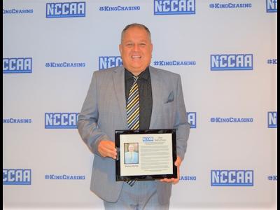 CIU AD Darren Richie displays his NCCAA Hall of Fame plaque. (Photo: NCCAA)
