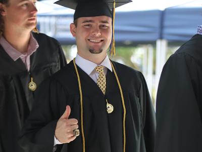 Thumbs up on graduation day at CIU, a Best Value for Regional Universities in the South