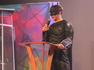 Batman, representing Justitia, the House of Justice, calls for justice and unity on campus. (Photo by Chariti Mealing) 