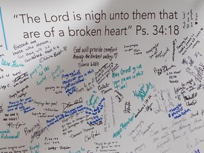 A close-up of a portion of the banner of condolences from Bob Jones University to CIU. 