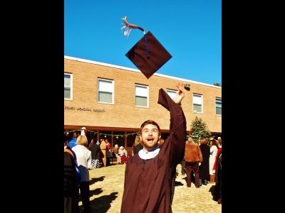 Timothy Wolff celebrates after earning his master's degree in Teaching English as a Foreign Language/Intercultural Studies 