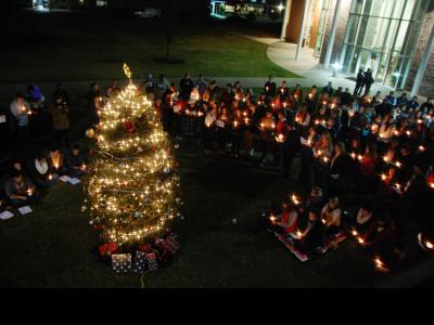 CIU students sing carols as the Christmas tree is lit. 